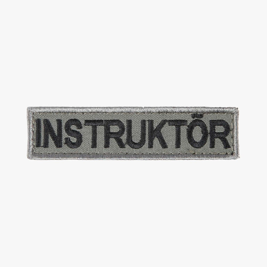 Snigel INSTRUKTÖR-märke (Litet) 100 × 25 mm – Kardborremärke (Grå/Svart)