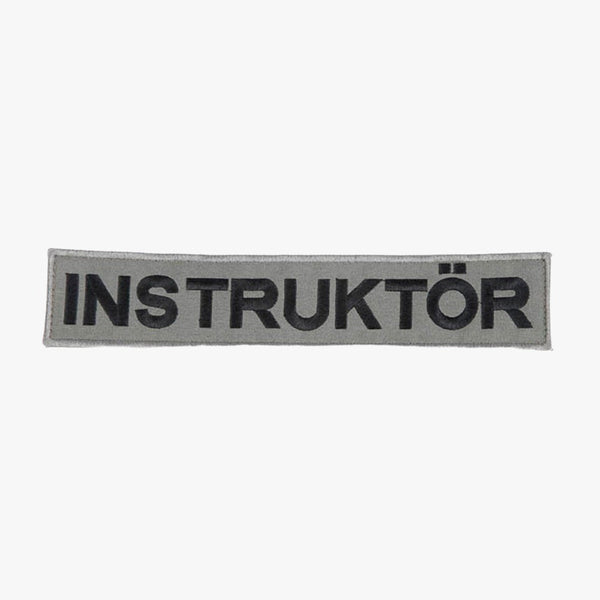 Snigel INSTRUKTÖR-märke (Stort) 260 × 50 mm – Kardborremärke (Grå/Svart)