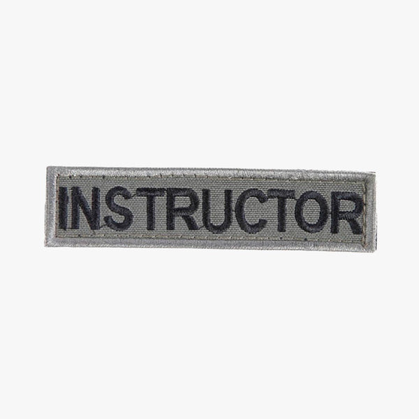 Snigel INSTRUCTOR-märke (Small) 100 × 25 mm – Kardborremärke (Grå/Svart)